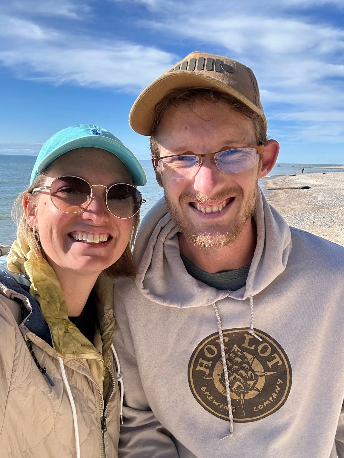 Jason and Kristen smiling together at the beach